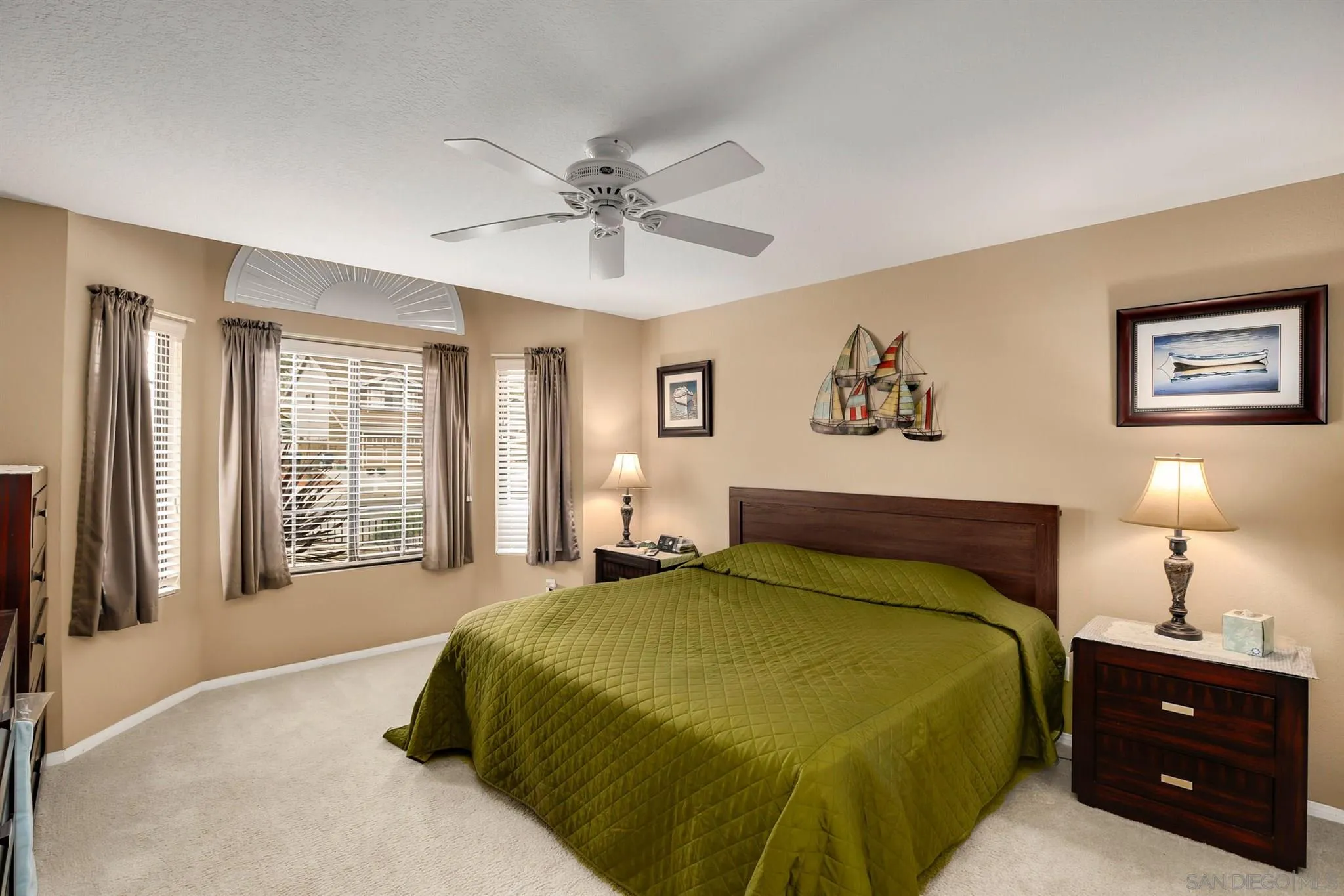 1753 Harold Road Escondido, CA 92026 - Photo 19 of 28 a bedroom with a large bed and a chandelier