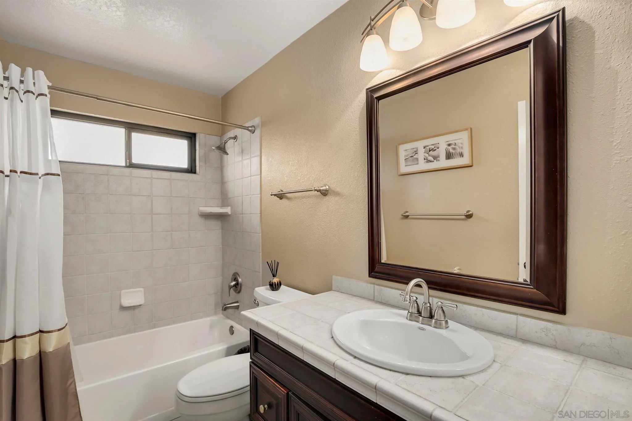 1753 Harold Road Escondido, CA 92026 - Photo 20 of 28 a bathroom with a granite countertop sink toilet and shower