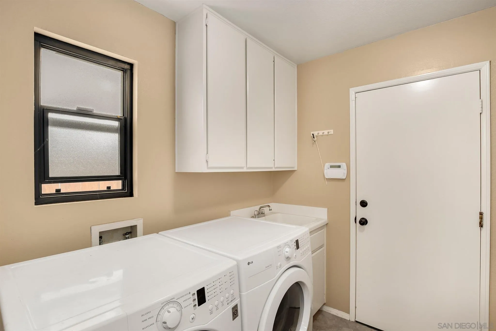 1753 Harold Road Escondido, CA 92026 - Photo 22 of 28 a utility room with dryer and washer