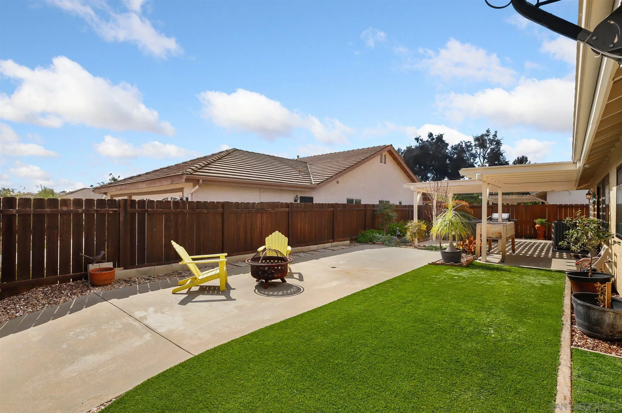 1753 Harold Road Escondido, CA 92026 - Photo 23 of 28 a view of a house with backyard and sitting area