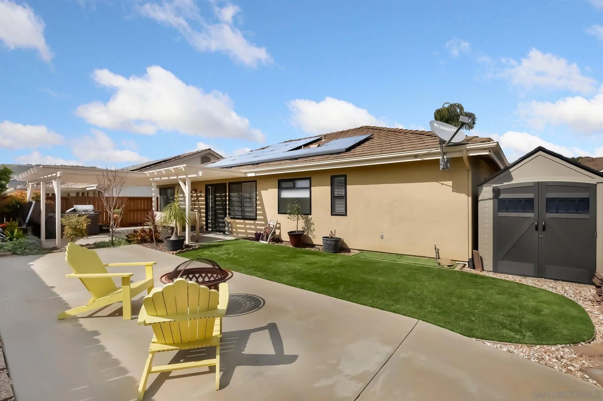1753 Harold Road Escondido, CA 92026 - Photo 24 of 28 a view of a house with backyard sitting area and garden