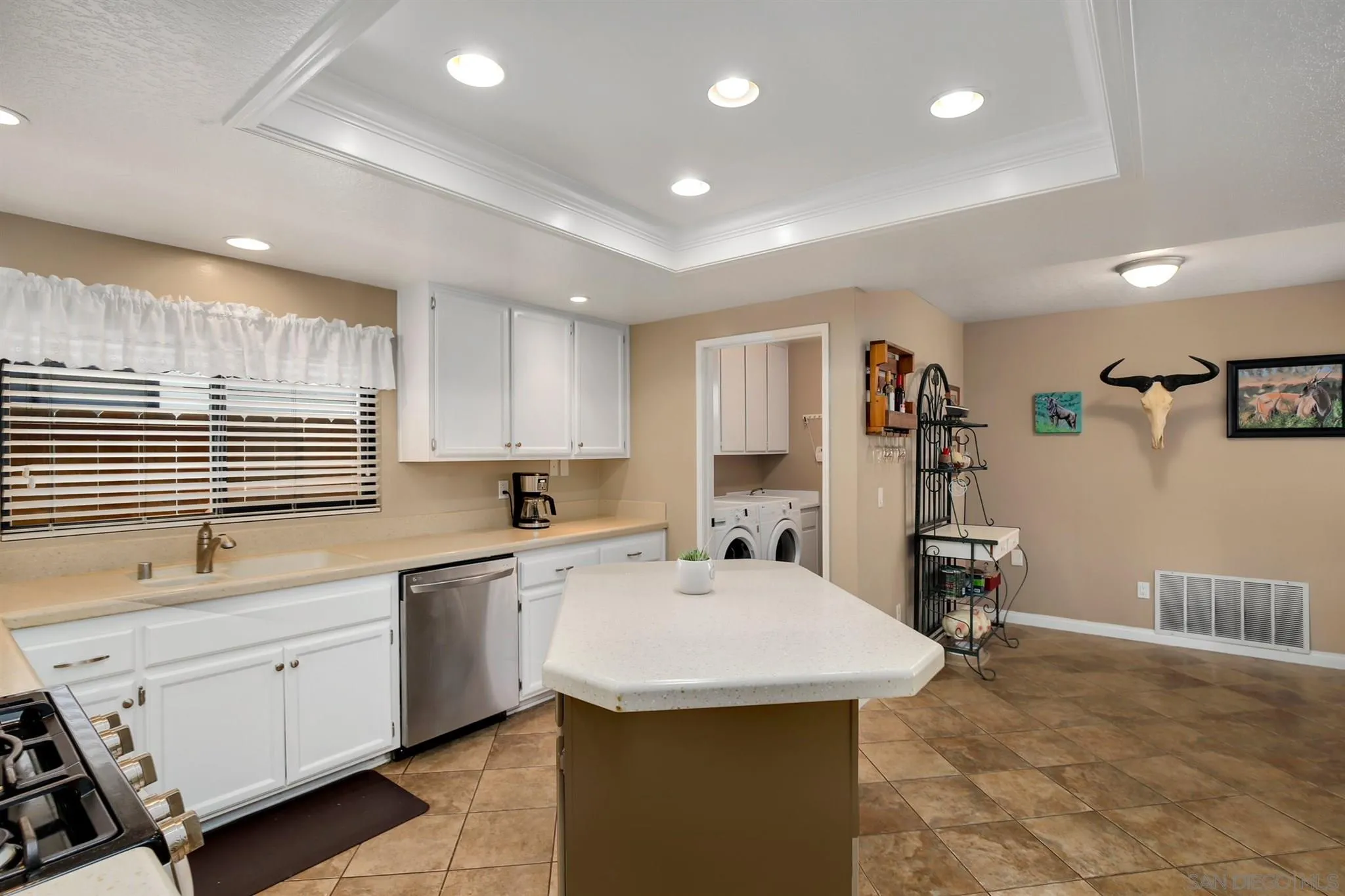 1753 Harold Road Escondido, CA 92026 - Photo 6 of 28 a kitchen with a sink a stove a refrigerator and cabinets