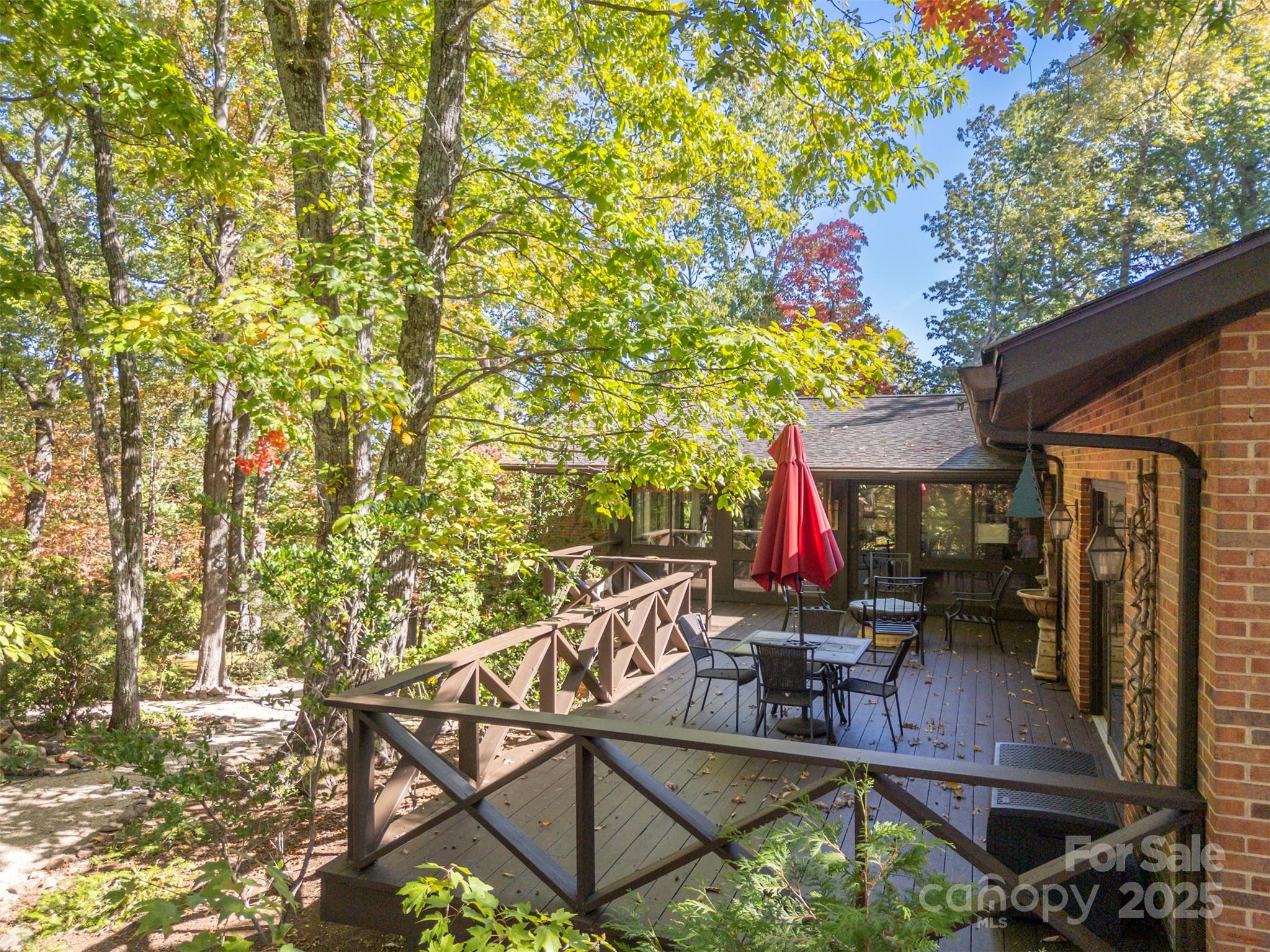550 Ridgetop Road Tryon, NC 28782 - Photo 22 of 39 a view of a chairs and table in the patio