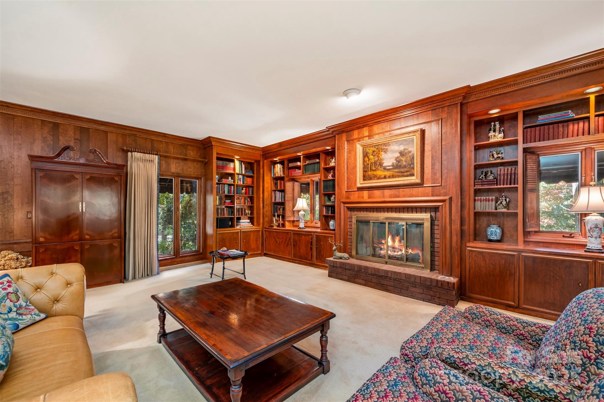 550 Ridgetop Road Tryon, NC 28782 - Photo 3 of 39 a living room with furniture a flat screen tv and a fireplace