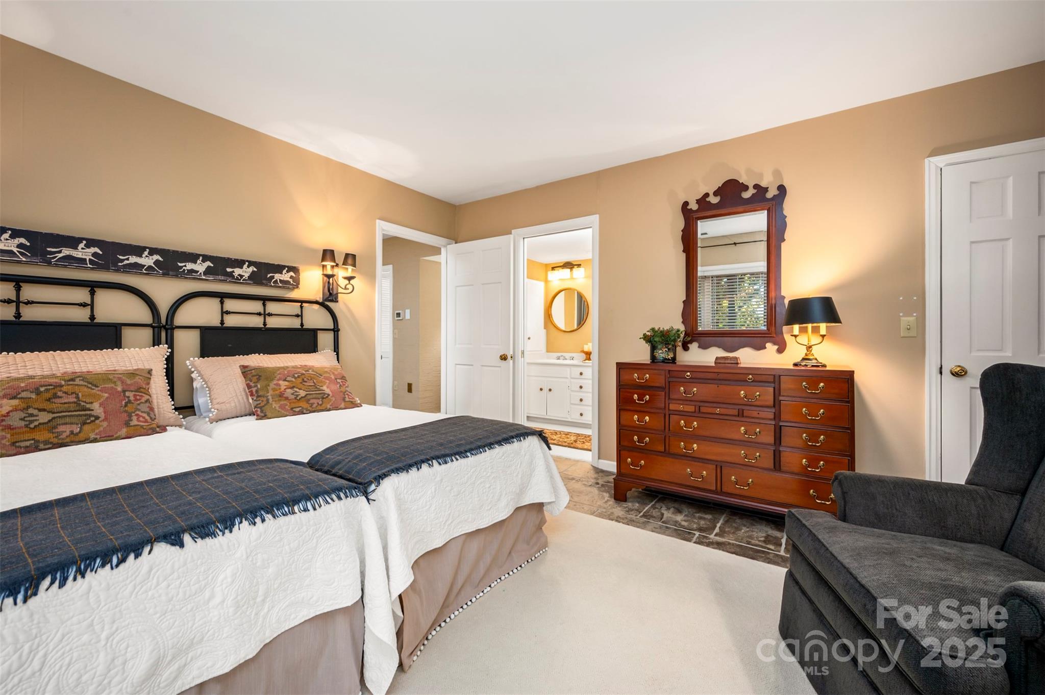 550 Ridgetop Road Tryon, NC 28782 - Photo 31 of 39 a bedroom with a bed and dresser with mirror
