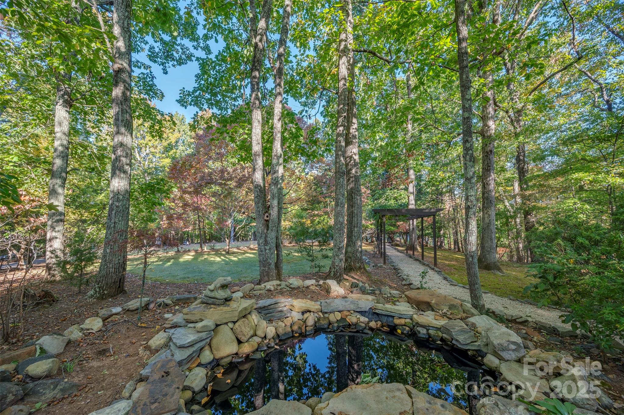550 Ridgetop Road Tryon, NC 28782 - Photo 34 of 39 a big yard with lots of green space and trees