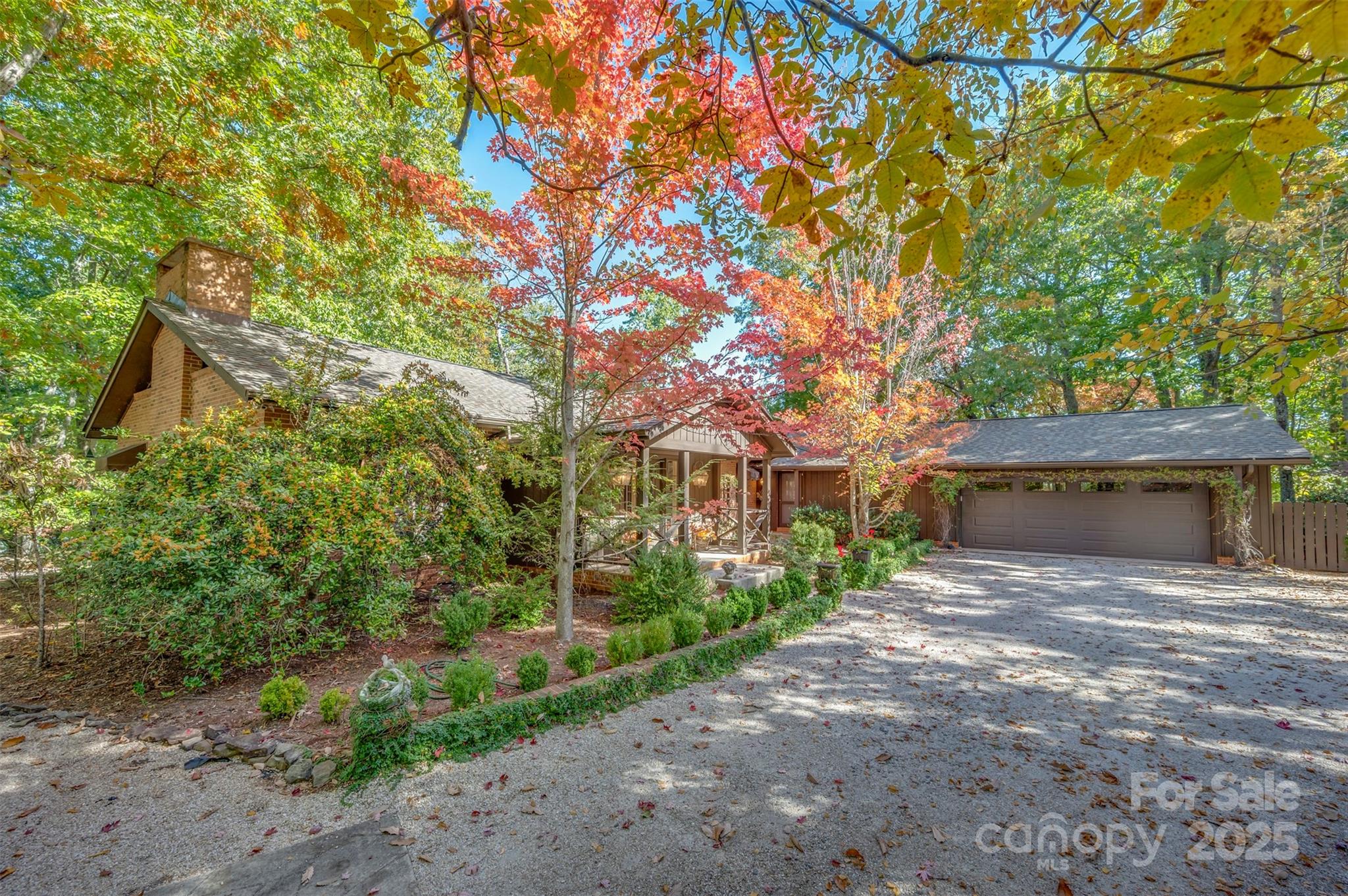 550 Ridgetop Road Tryon, NC 28782 - Photo 37 of 39 a front view of a house with a yard and tree s