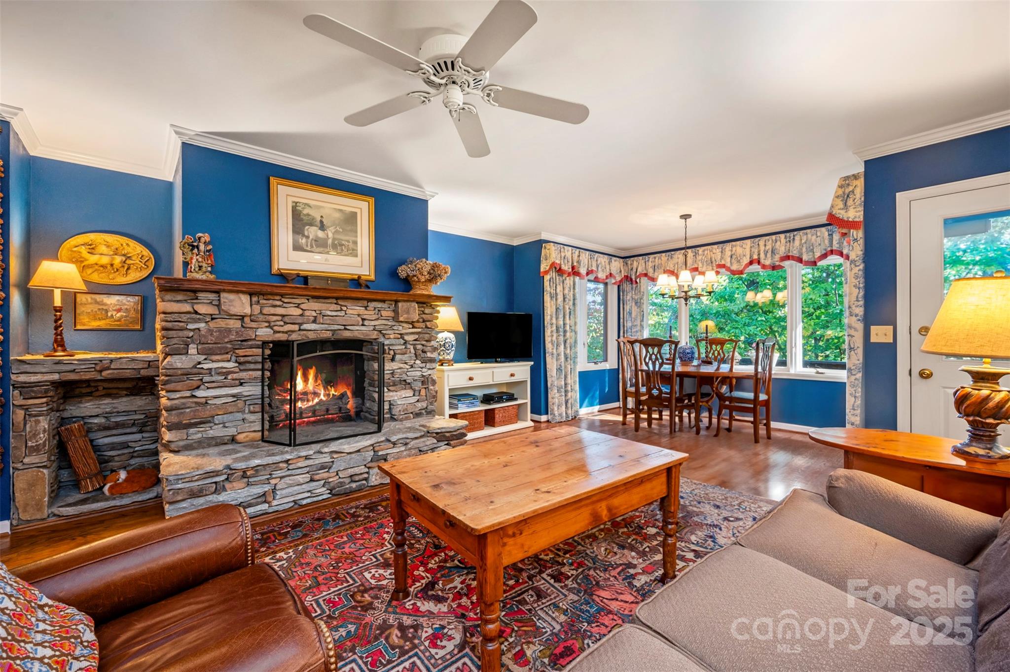 550 Ridgetop Road Tryon, NC 28782 - Photo 8 of 39 a living room with furniture a flat screen tv and a fireplace
