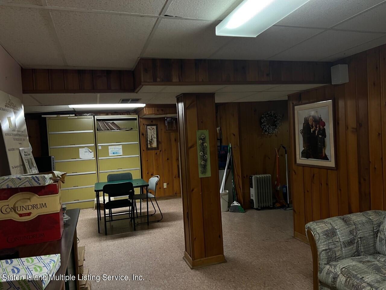 2760 Amboy Road Staten Island, NY 10306 - Photo 14 of 16 a view of a livingroom with furniture and gym equipment