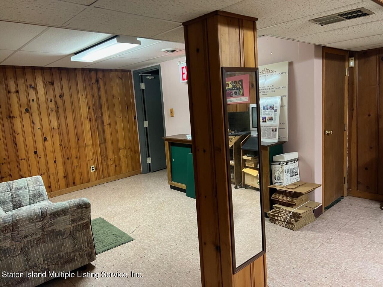 2760 Amboy Road Staten Island, NY 10306 - Photo 15 of 16 a view of a hallway with couch and closet