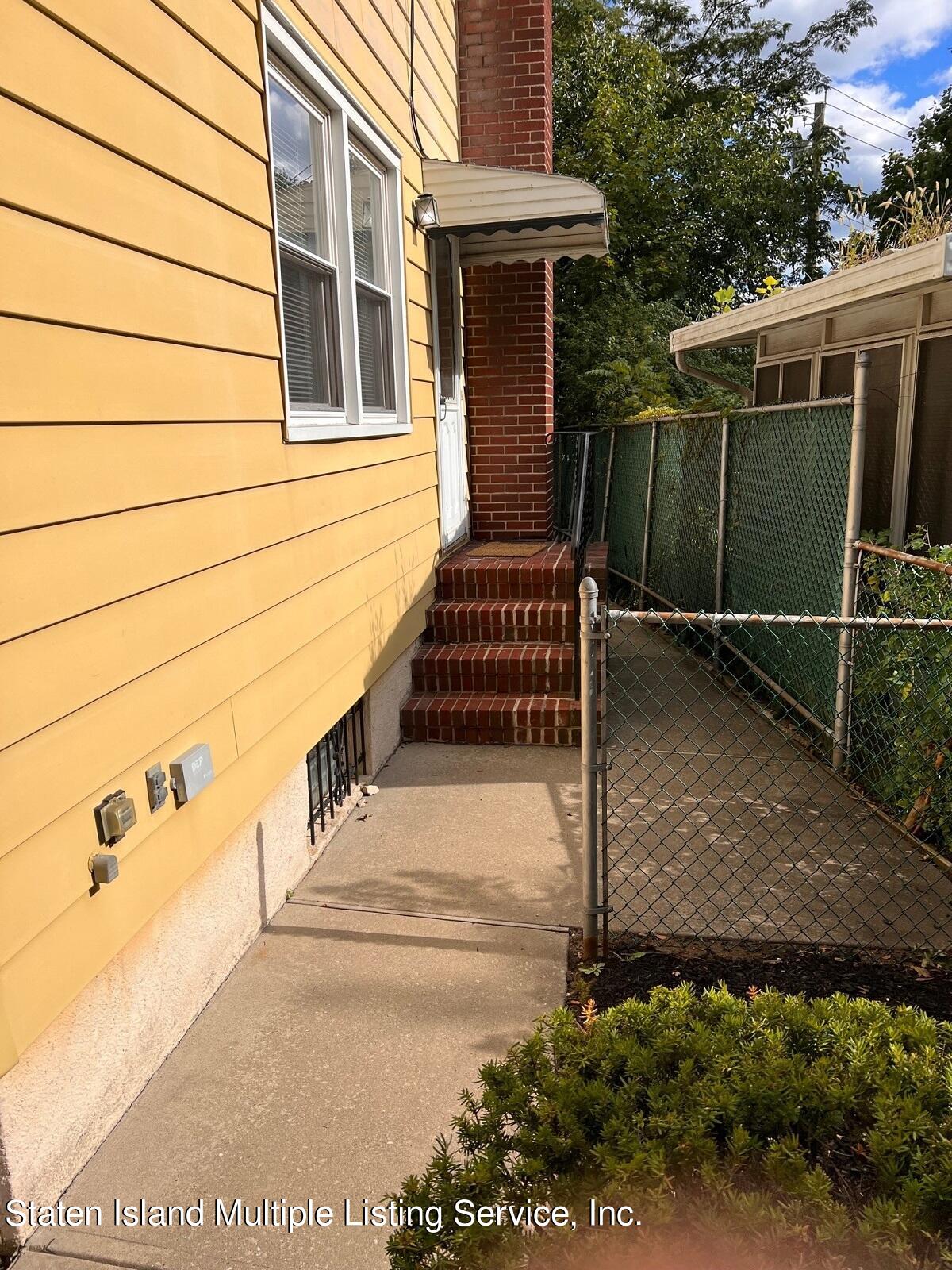 2760 Amboy Road Staten Island, NY 10306 - Photo 5 of 16 a view of a pathway with a house