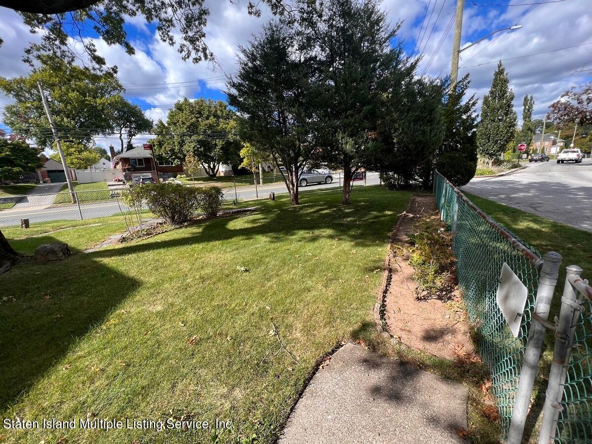 2760 Amboy Road Staten Island, NY 10306 - Photo 7 of 16 a view of yard with swimming pool and green space