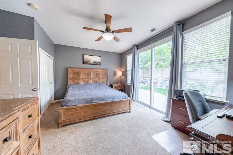 2104 Hazelcrest Drive Reno, NV 89521 - Photo 14 of 27 a bed room with a bed and a chair