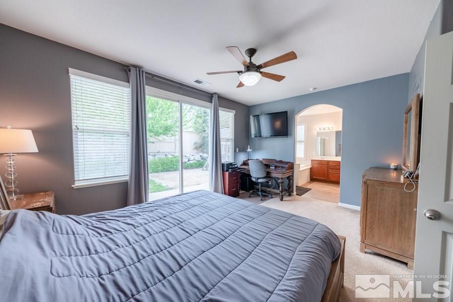 2104 Hazelcrest Drive Reno, NV 89521 - Photo 15 of 27 a bedroom with a bed large window and furniture