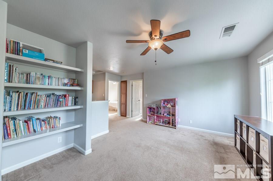 2104 Hazelcrest Drive Reno, NV 89521 - Photo 20 of 27 a view of a livingroom with a book shelf