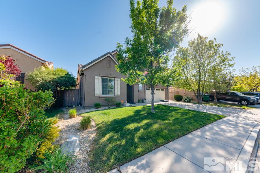 2104 Hazelcrest Drive Reno, NV 89521 - Photo 2 of 27 a view of a house with a yard and tree s