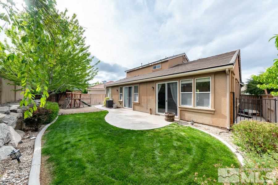 2104 Hazelcrest Drive Reno, NV 89521 - Photo 25 of 27 a front view of house with a garden and patio
