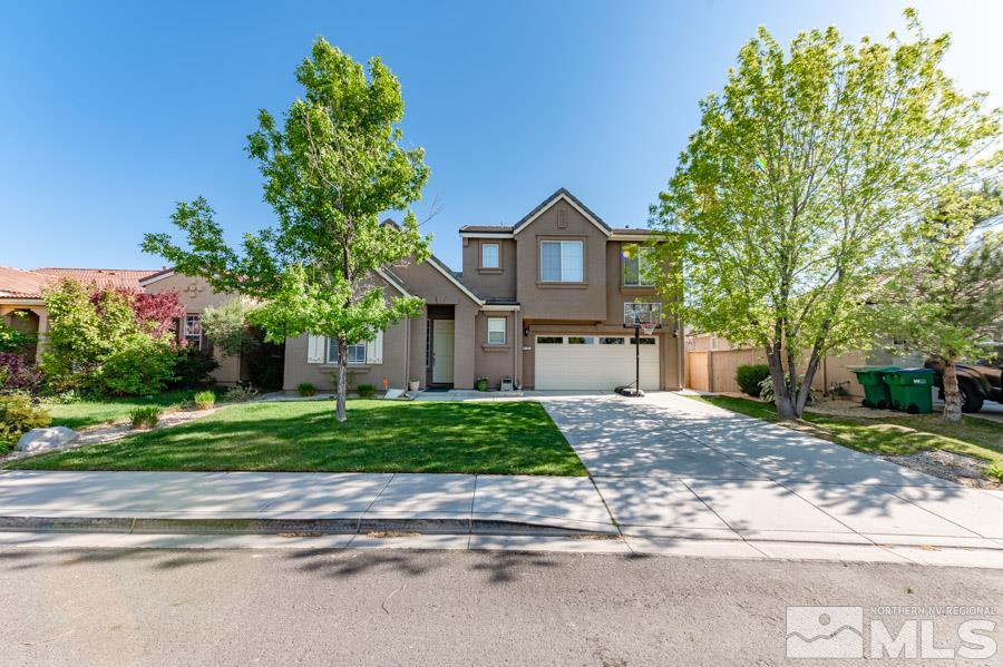 2104 Hazelcrest Drive Reno, NV 89521 - Photo 3 of 27 a front view of a house with a yard and a street