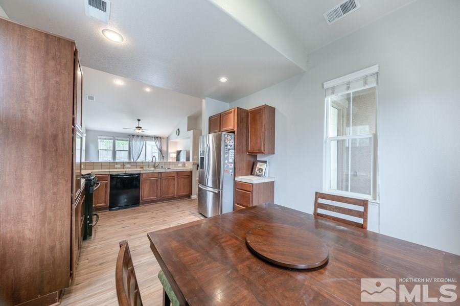 2104 Hazelcrest Drive Reno, NV 89521 - Photo 4 of 27 a kitchen with refrigerator and cabinets