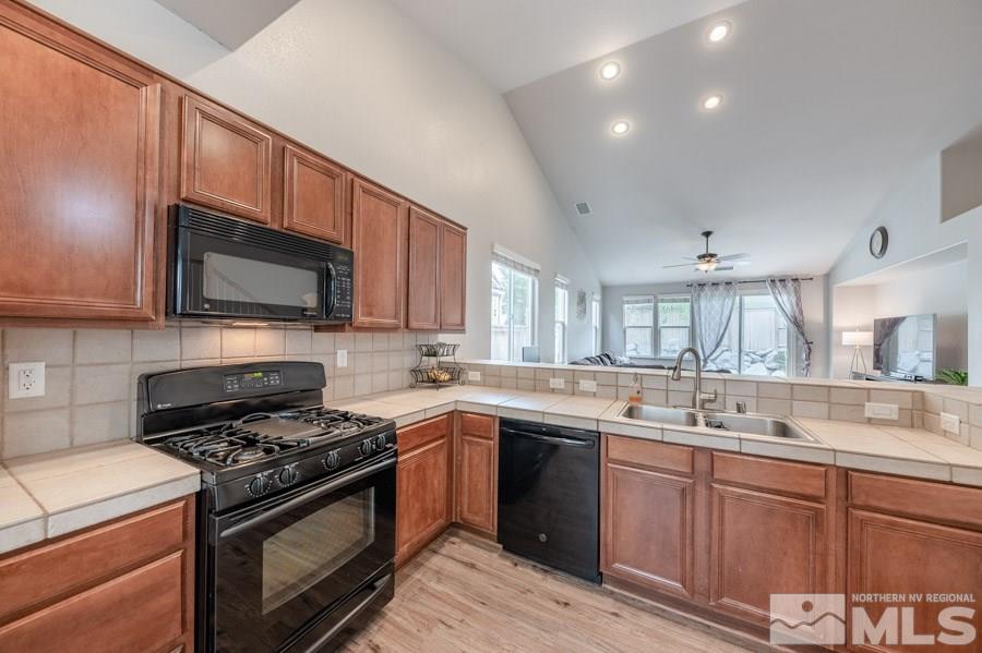 2104 Hazelcrest Drive Reno, NV 89521 - Photo 6 of 27 a kitchen with a sink stove and microwave