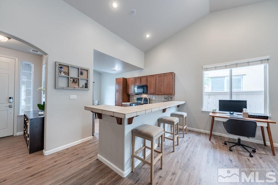 2104 Hazelcrest Drive Reno, NV 89521 - Photo 7 of 27 a view of a workspace with furniture and wooden floor