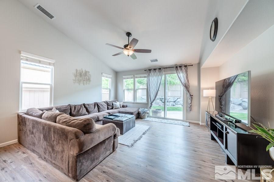 2104 Hazelcrest Drive Reno, NV 89521 - Photo 8 of 27 a living room with furniture flat screen tv and a large window