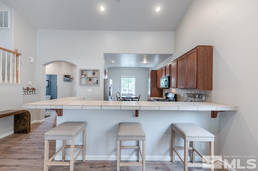 2104 Hazelcrest Drive Reno, NV 89521 - Photo 9 of 27 a kitchen with cabinets and chairs