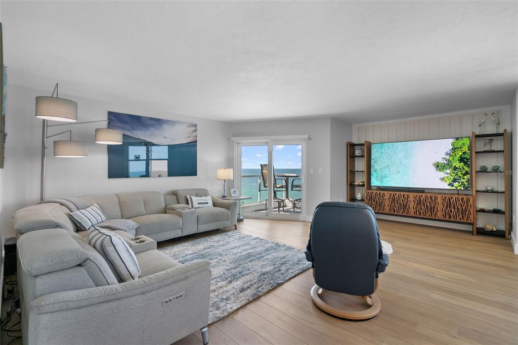1050 Longboat Club Road, Unit 901 Longboat Key, FL 34228 - Photo 3 of 37 a living room with furniture and a large window