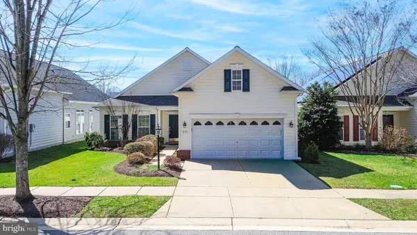 an aerial view of a house with swimming pool and outdoor space