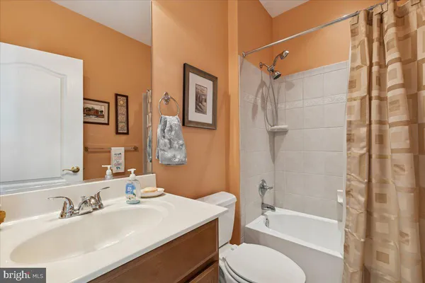 a view of a workspace with furniture and wooden floor