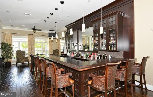 a kitchen that has a dining table and chairs