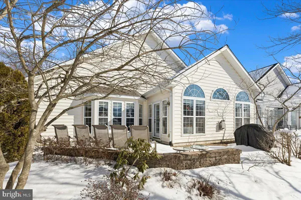 a bedroom with a bed next to a window