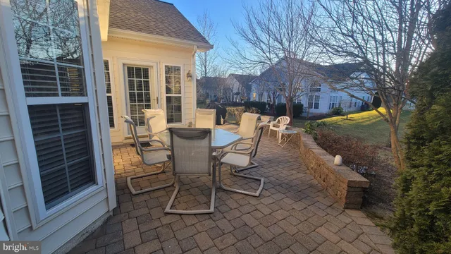 a patio with table and chairs