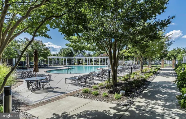 a room with pool table and windows