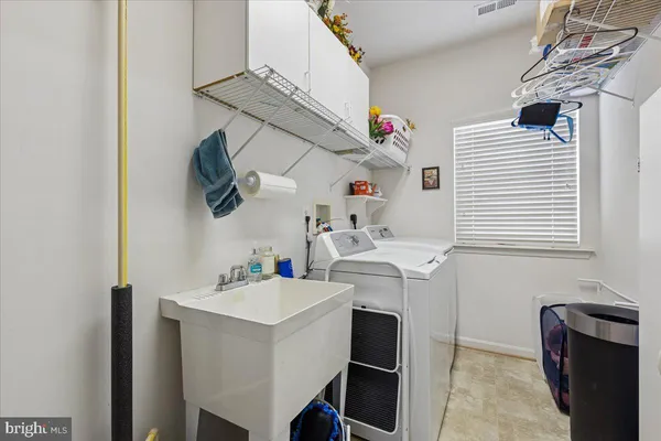 a living room with furniture and a piano