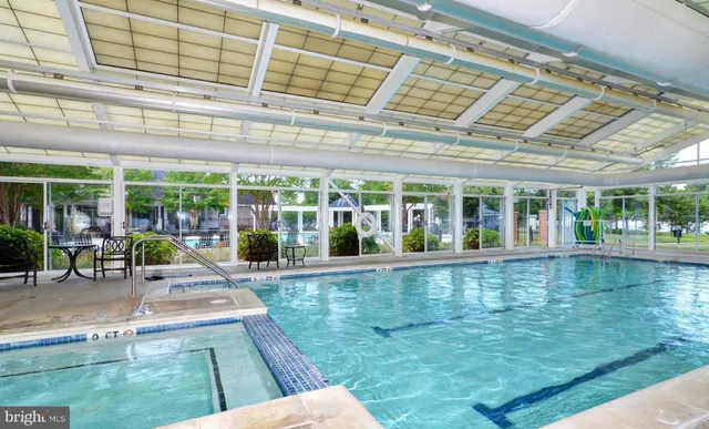 a view of a swimming pool with a patio