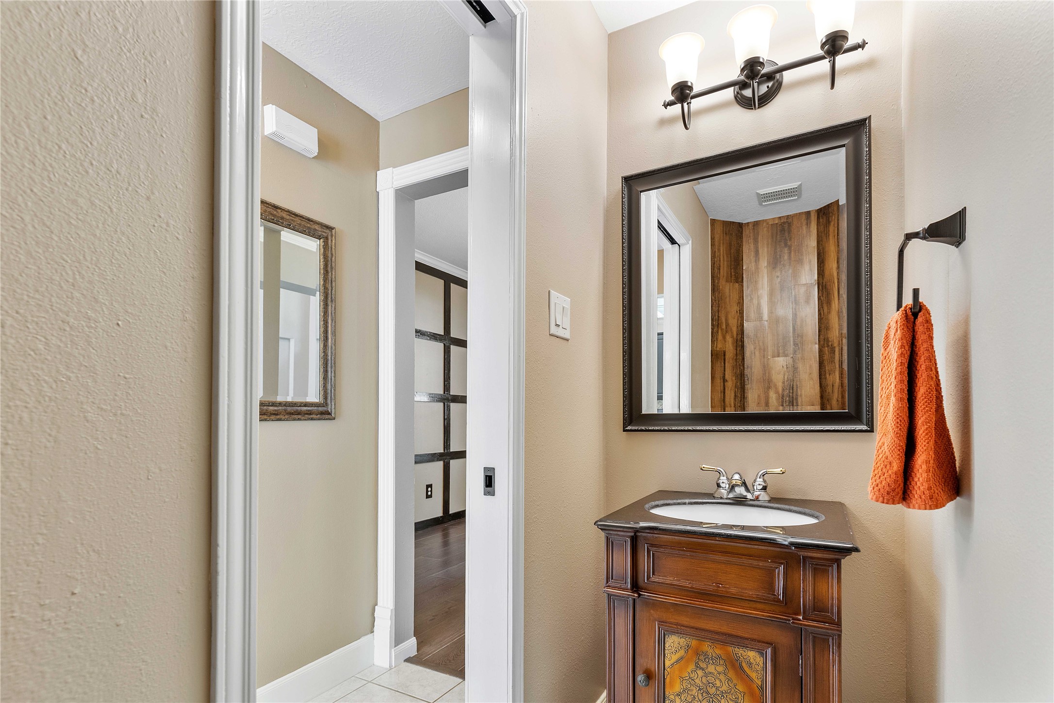 19819 Cherry Oaks Lane Humble, TX 77346 - Photo 24 of 47 The half back is located right between the kitchen and dining room, ensuring your guests have constant access while entertaining.