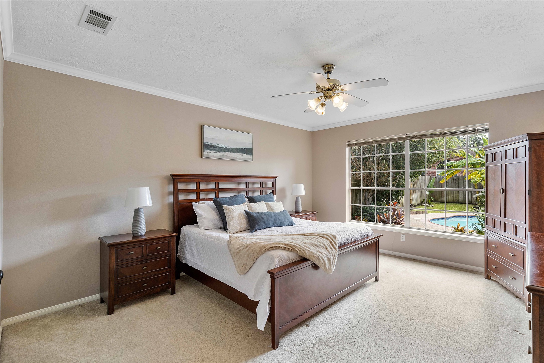 19819 Cherry Oaks Lane Humble, TX 77346 - Photo 25 of 47 The oversize primary bedroom features room for a king bed and large side tables! Start your day waking up to a perfect view of your family pool and hot tub.