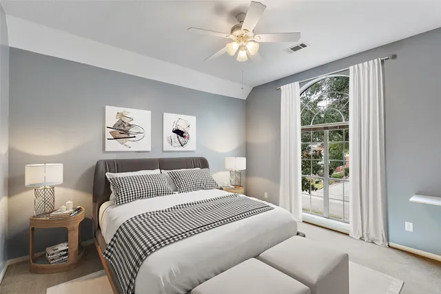 a view of a patio with a table and chairs and potted plants