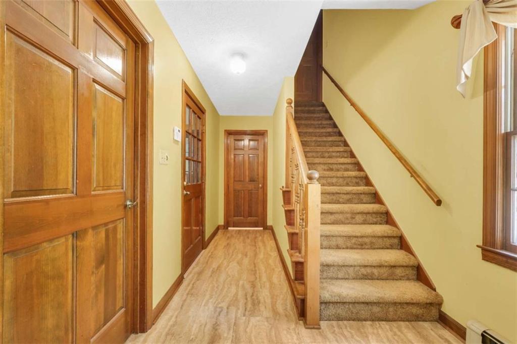 314 Winding Stream Trail Southwest Conyers, GA 30094 - Photo 38 of 59 a view of a hallway with wooden floor and staircase