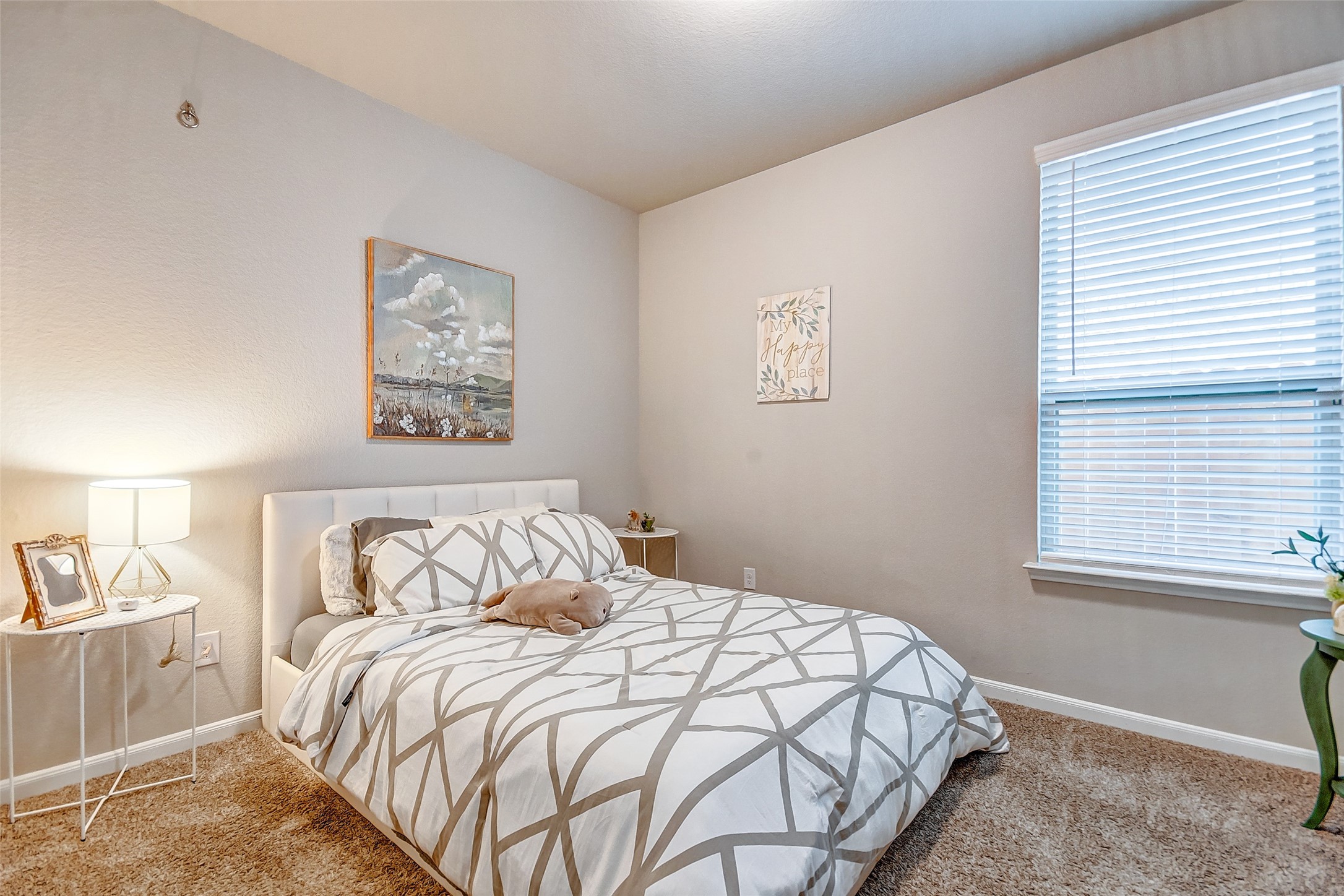 4239 Prairie Landing Lane Katy, TX 77494 - Photo 11 of 32 a bedroom with a bed and a window