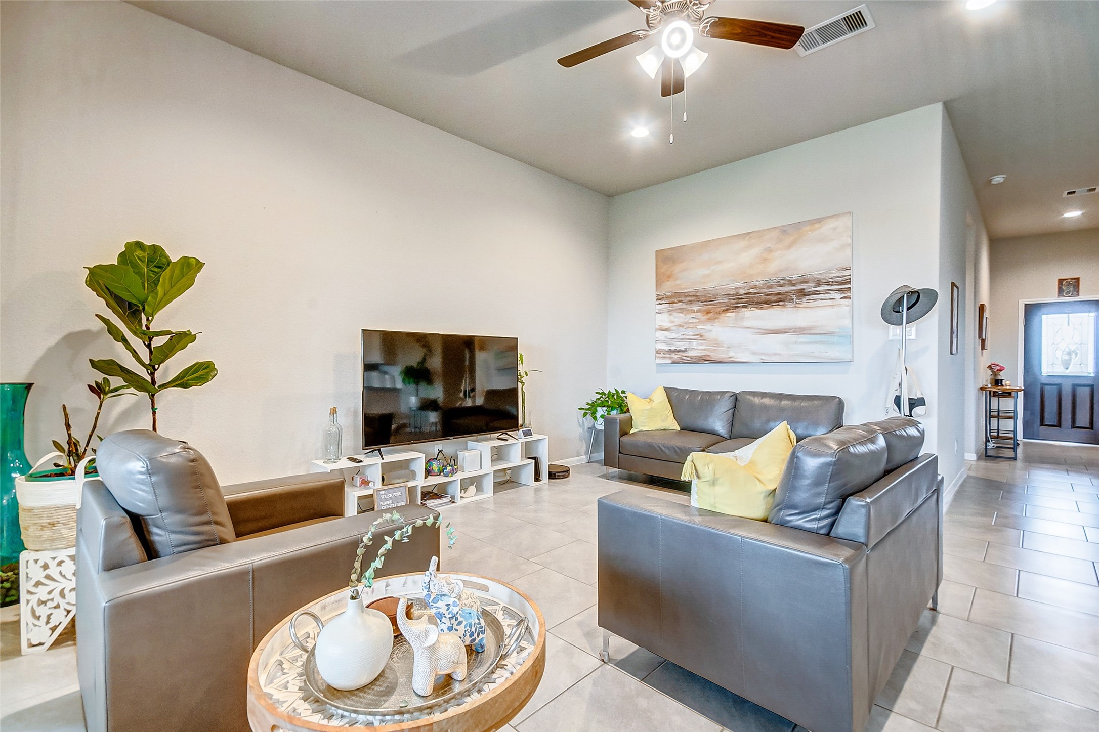 4239 Prairie Landing Lane Katy, TX 77494 - Photo 14 of 32 a living room with furniture and a flat screen tv