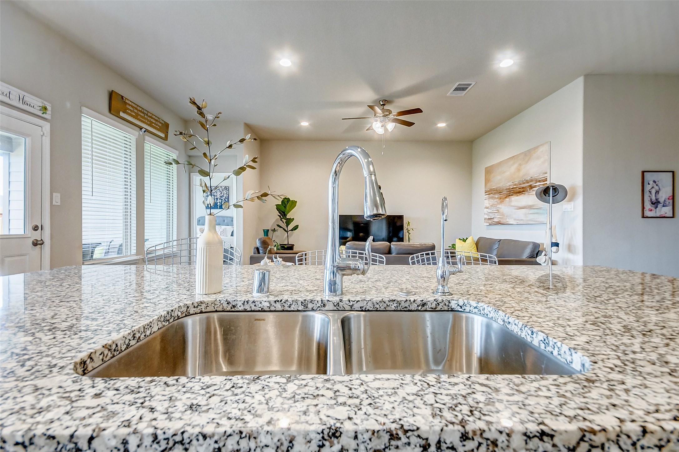 4239 Prairie Landing Lane Katy, TX 77494 - Photo 19 of 32 a kitchen with a sink a counter top space and cabinets