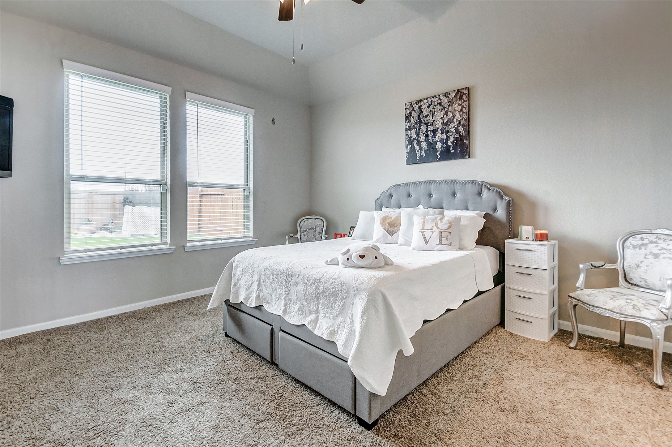 4239 Prairie Landing Lane Katy, TX 77494 - Photo 22 of 32 a bed sitting in a bedroom next to a window