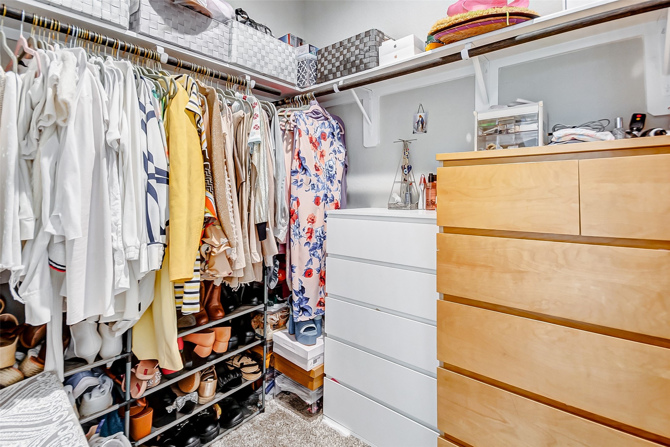 4239 Prairie Landing Lane Katy, TX 77494 - Photo 27 of 32 a view of walk in closet with clothes and shoes