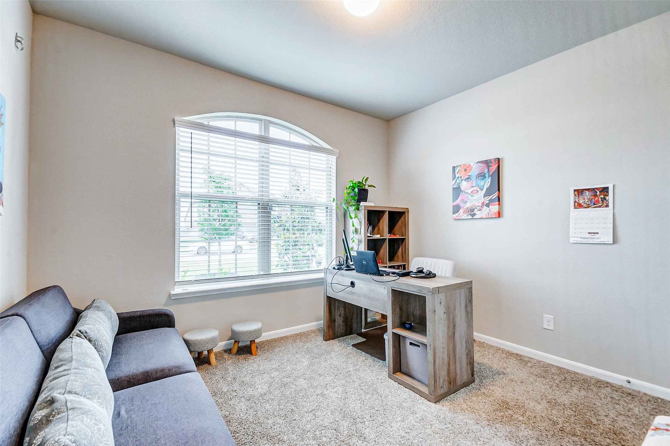 4239 Prairie Landing Lane Katy, TX 77494 - Photo 8 of 32 a view of a livingroom with workspace and a window