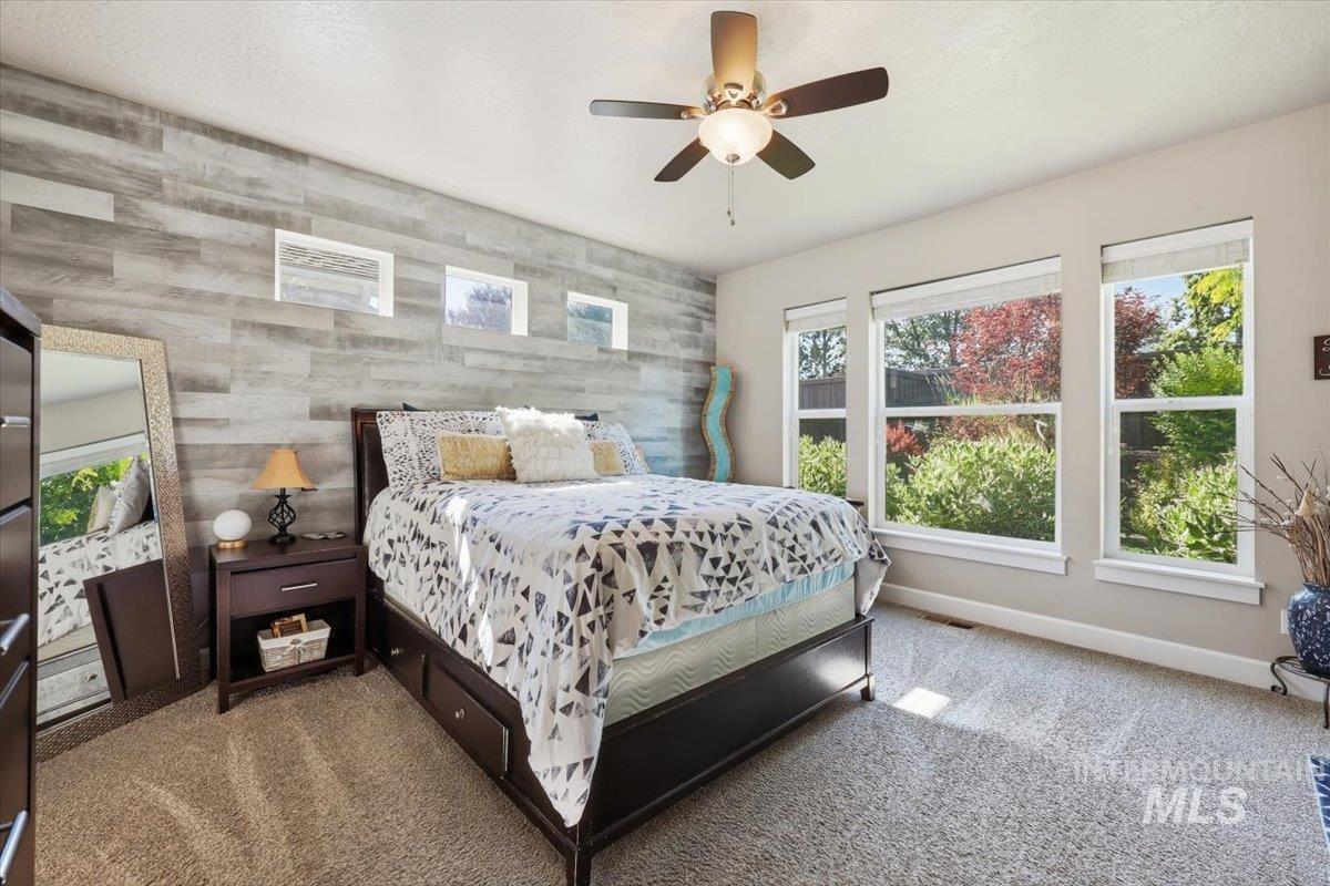 1303 West Brando Street Meridian, ID 83646 - Photo 22 of 49 Wall-to-wall carpeting and a ceiling fan with integrated lighting