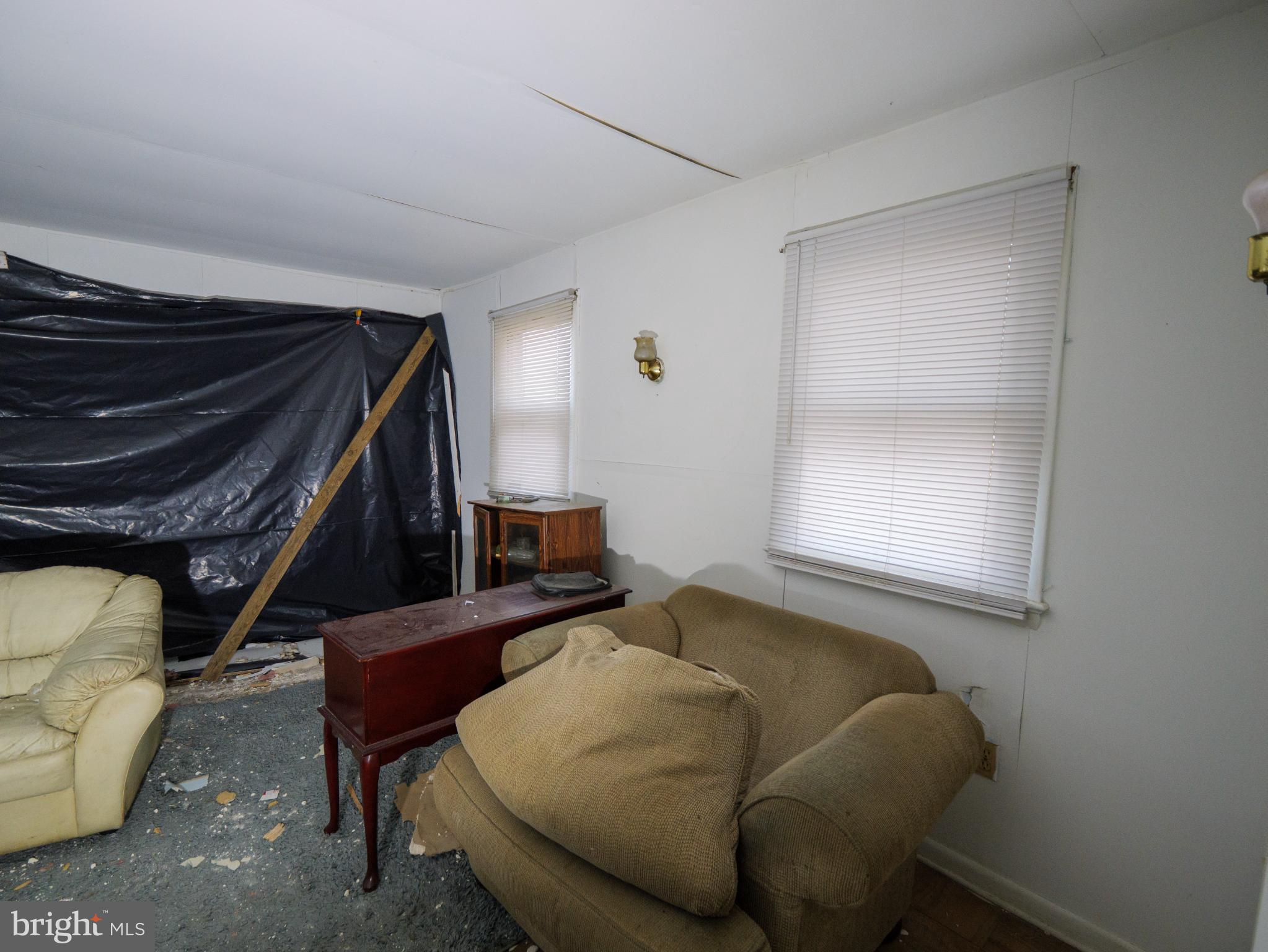 896 Mt Zion Marlboro Road Lothian, MD 20711 - Photo 14 of 22 a living room with furniture and a window
