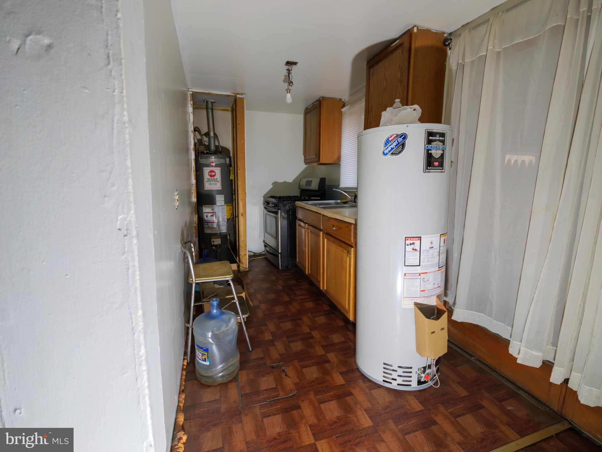896 Mt Zion Marlboro Road Lothian, MD 20711 - Photo 5 of 22 a kitchen with a refrigerator and a stove