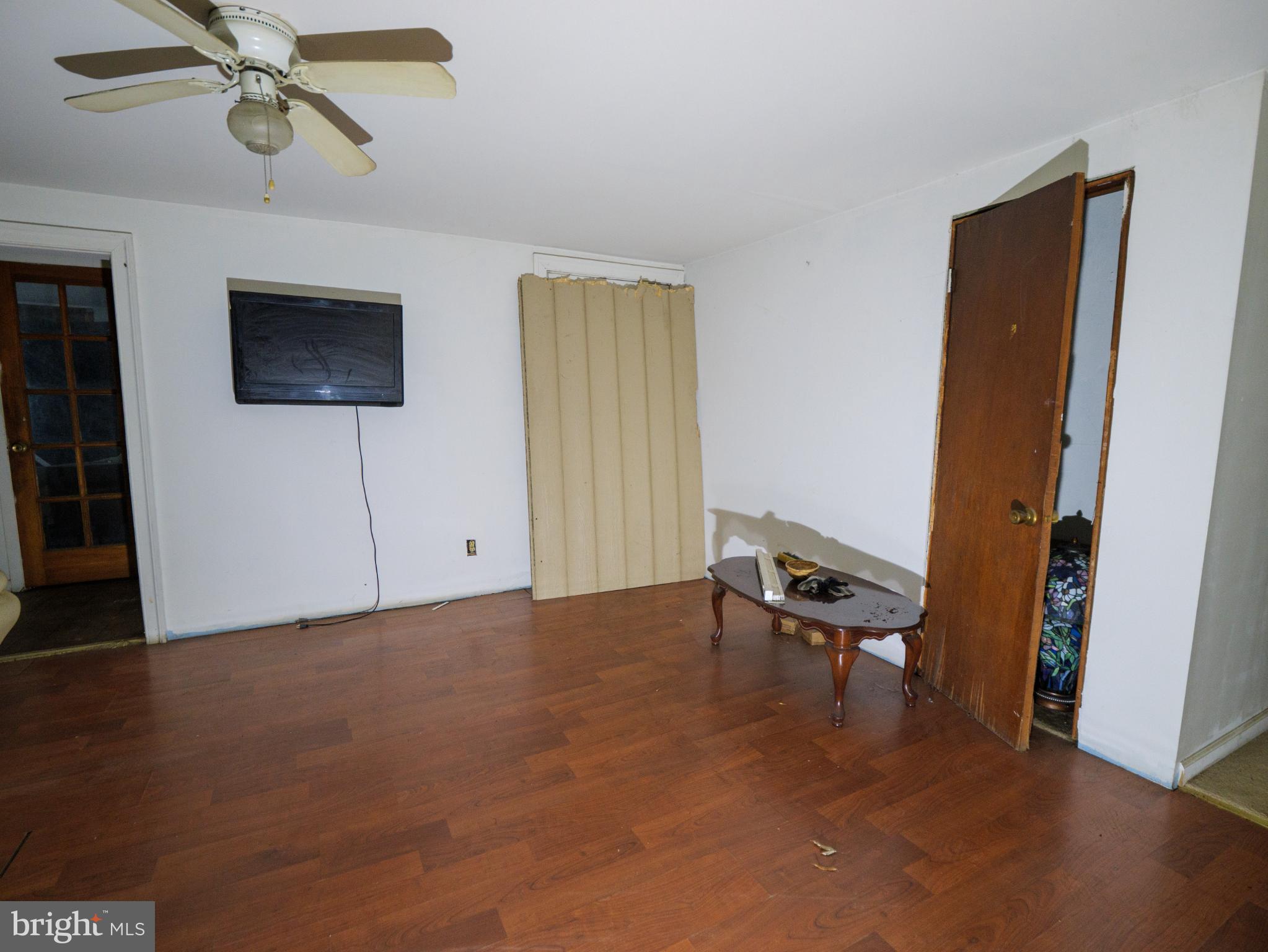 896 Mt Zion Marlboro Road Lothian, MD 20711 - Photo 7 of 22 an empty room with windows and fan